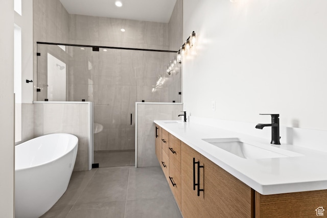 bathroom featuring vanity, tile patterned floors, and shower with separate bathtub