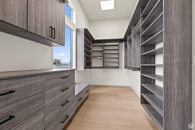 spacious closet featuring light wood-type flooring