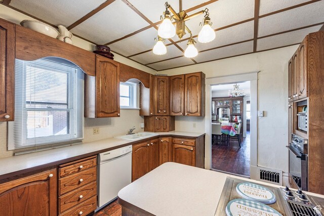 390 E Center St, Spanish Fork, UT 84660 - kitchen featuring pendant lighting, sink, black oven, dishwasher, and a chandelier