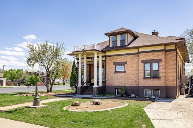 390 E Center St, Spanish Fork, UT 84660 - view of front facade with a balcony and a front lawn