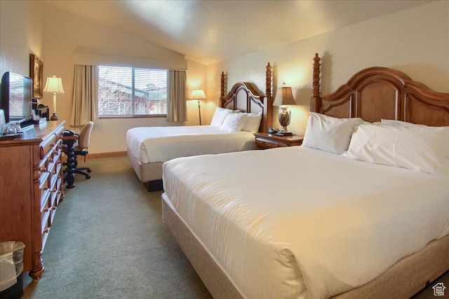 bedroom with vaulted ceiling and carpet