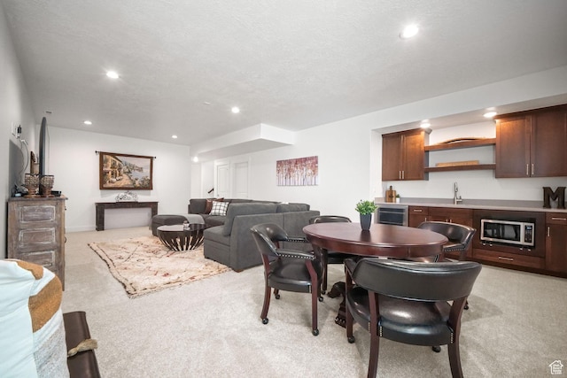 1712 S 1160 E, Heber City, UT 84032 - dining space featuring a textured ceiling, light colored carpet, beverage cooler, and indoor wet bar