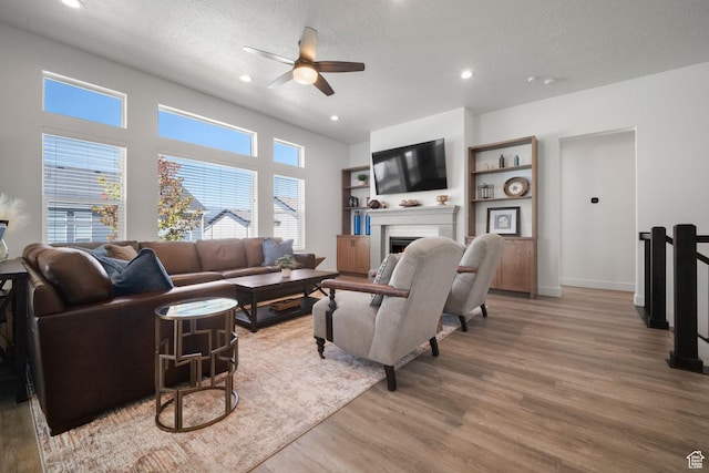 1712 S 1160 E, Heber City, UT 84032 - living room featuring ceiling fan, light hardwood / wood-style floors, and a textured ceiling