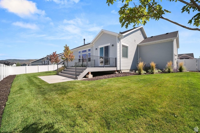 1712 S 1160 E, Heber City, UT 84032 - rear view of house with a patio, a deck, and a lawn
