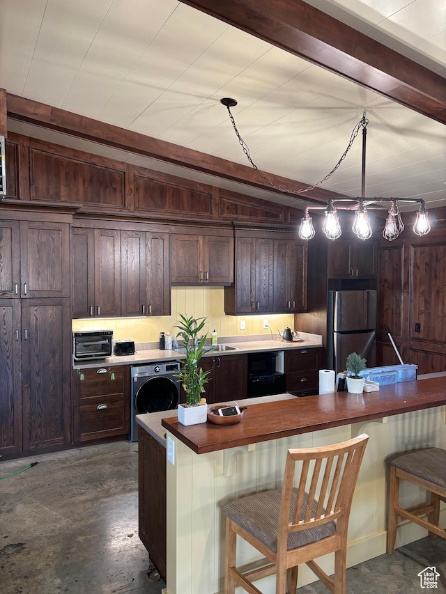 361 N 100 W, Holden, UT 84636 - kitchen with pendant lighting, washer / clothes dryer, stainless steel fridge, and a breakfast bar area