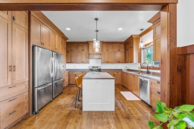 361 N 100 W, Holden, UT 84636 - kitchen with pendant lighting, sink, a center island, stainless steel appliances, and light wood-type flooring