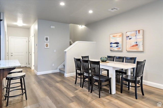 dining area with hardwood / wood-style floors
