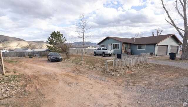 1904 N Rocky Ford Rd, Sigurd, UT 84657 - view of front of property with a garage and a mountain view