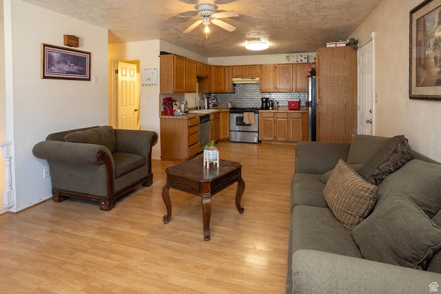 1904 N Rocky Ford Rd, Sigurd, UT 84657 - living room with ceiling fan, light hardwood / wood-style floors, sink, and a textured ceiling