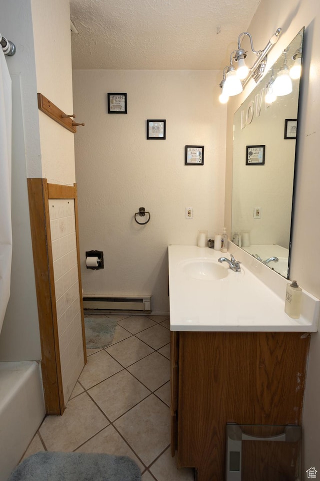 1904 N Rocky Ford Rd, Sigurd, UT 84657 - bathroom with baseboard heating, vanity, a textured ceiling, tile patterned floors, and a bathing tub