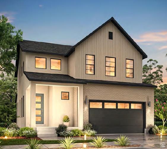 modern inspired farmhouse featuring a garage
