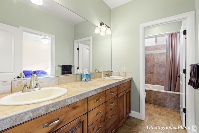 bathroom featuring tile patterned flooring, vanity, and shower / bath combo