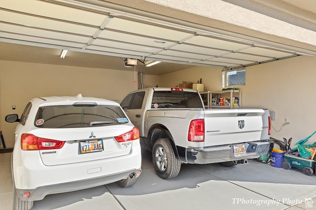 garage with a carport and a garage door opener