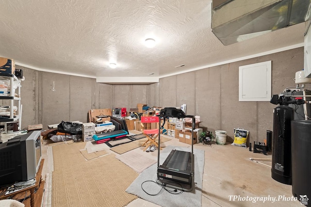 workout area featuring a textured ceiling