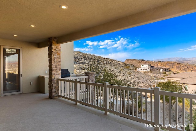 balcony featuring a mountain view