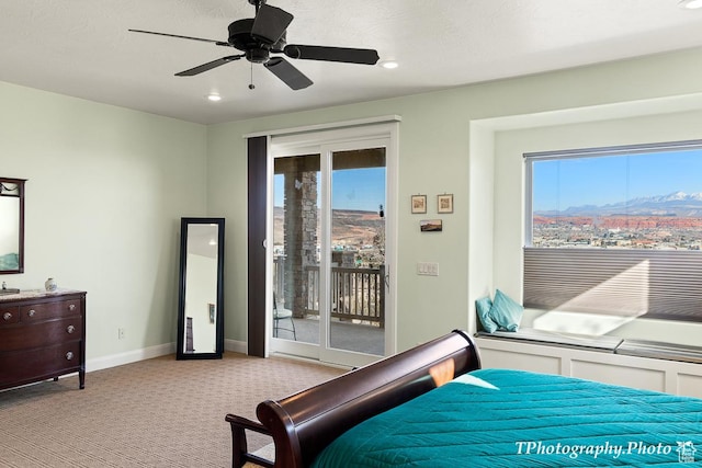 carpeted bedroom featuring ceiling fan and access to exterior