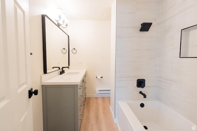 1898 N Rocky Ford Dr, Sigurd, UT 84657 - full bathroom featuring a baseboard radiator, wood finished floors, vanity, bathtub / shower combination, and baseboards