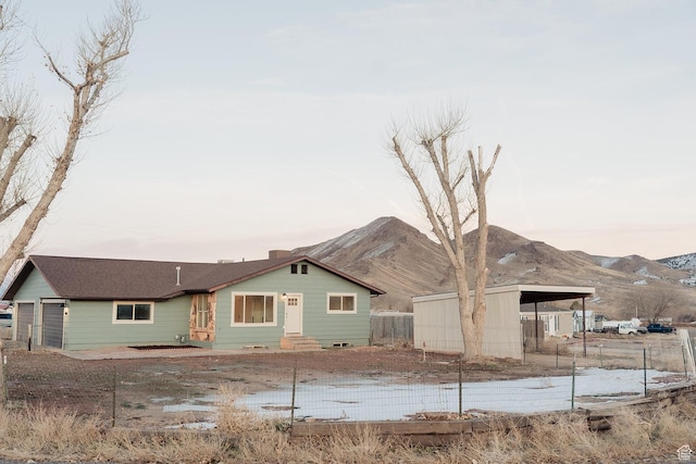 1898 N Rocky Ford Dr, Sigurd, UT 84657 - rear view of property with fence, a mountain view, and entry steps