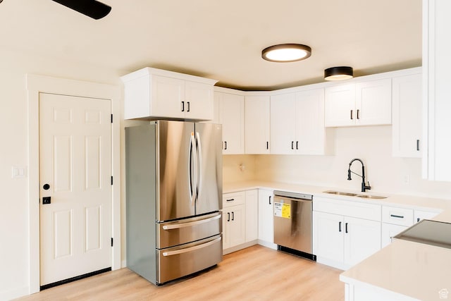 1898 N Rocky Ford Dr, Sigurd, UT 84657 - kitchen featuring stainless steel appliances, a sink, light wood-style floors, and white cabinetry