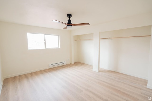 1898 N Rocky Ford Dr, Sigurd, UT 84657 - unfurnished bedroom featuring a baseboard radiator, two closets, light wood finished floors, and ceiling fan