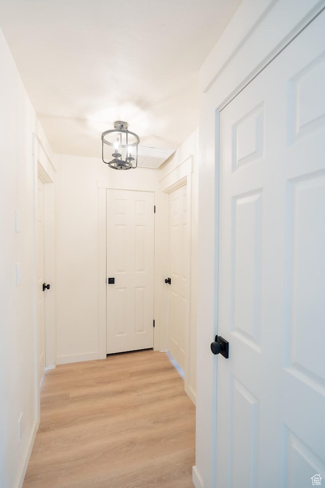 1898 N Rocky Ford Dr, Sigurd, UT 84657 - hall with light wood finished floors, a chandelier, and baseboards