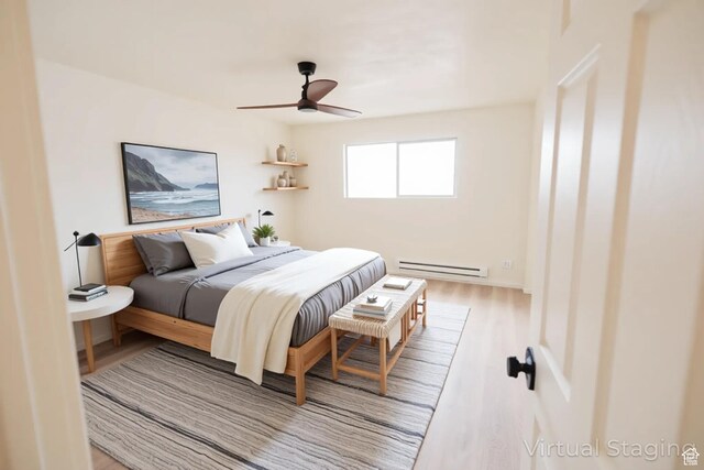 1898 N Rocky Ford Dr, Sigurd, UT 84657 - bedroom featuring a baseboard heating unit, wood finished floors, and ceiling fan