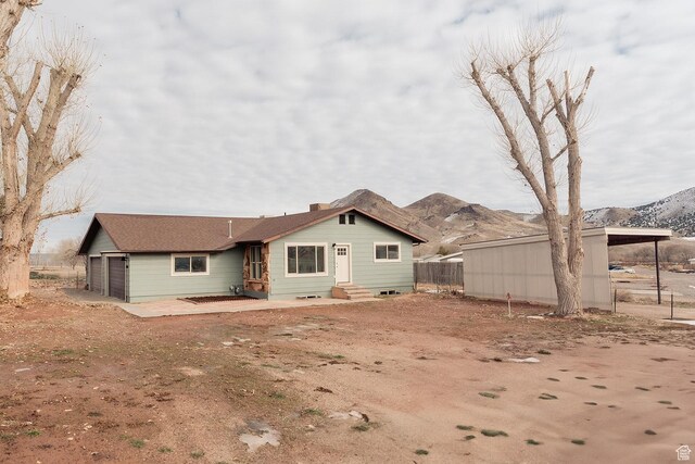 1898 N Rocky Ford Dr, Sigurd, UT 84657 - rear view of property with entry steps, a mountain view, and fence