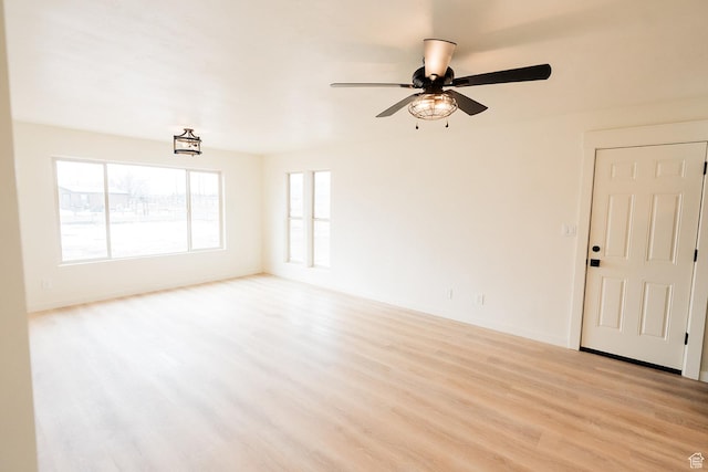 1898 N Rocky Ford Dr, Sigurd, UT 84657 - spare room with light wood-style flooring, a ceiling fan, and baseboards