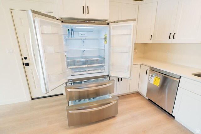 1898 N Rocky Ford Dr, Sigurd, UT 84657 - kitchen featuring stainless steel dishwasher, light wood-style floors, white cabinetry, and light countertops