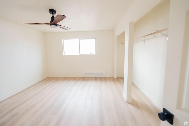 1898 N Rocky Ford Dr, Sigurd, UT 84657 - unfurnished bedroom featuring a baseboard heating unit, wood finished floors, baseboards, and a ceiling fan