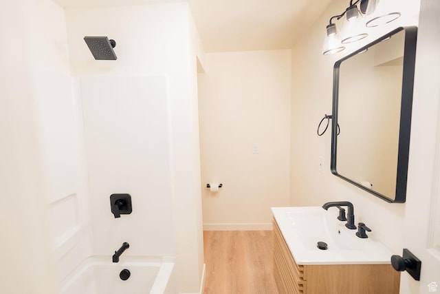 1898 N Rocky Ford Dr, Sigurd, UT 84657 - bathroom with wood finished floors, vanity, shower / bathtub combination, and baseboards