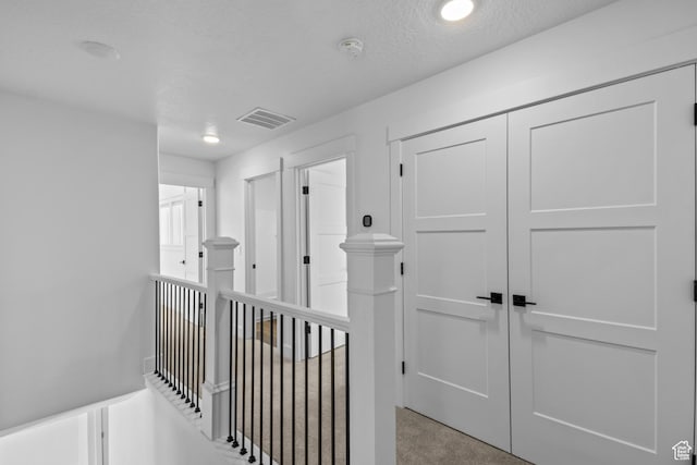 1246 W 575 S Unit 154, Logan, UT 84321 - hallway with a textured ceiling