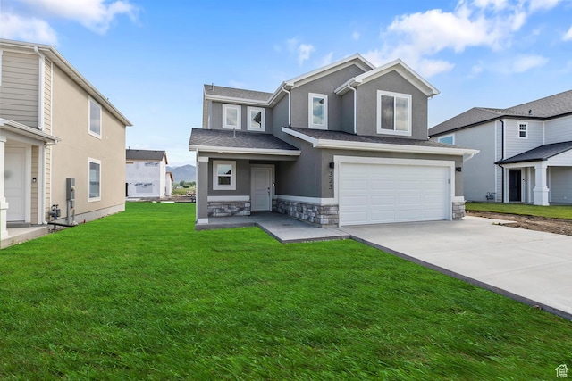 view of front of property with a garage and a front yard
