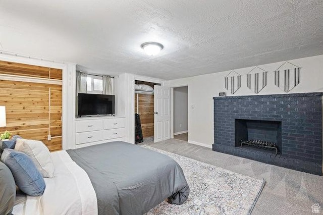 575 N 300 E, Tremonton, UT 84337 - bedroom with baseboards, a fireplace, a textured ceiling, and carpet