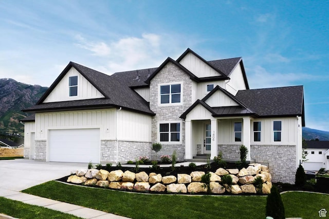 5291 W 3775 S Unit 22, Hooper, UT 84315 - view of front of house featuring a mountain view, a garage, and a front lawn