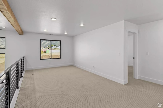 5291 W 3775 S Unit 22, Hooper, UT 84315 - spare room featuring light colored carpet and beam ceiling