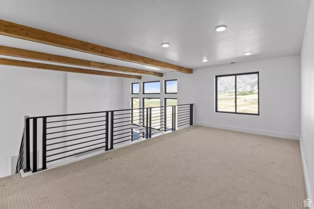 5291 W 3775 S Unit 22, Hooper, UT 84315 - carpeted spare room featuring beamed ceiling and plenty of natural light