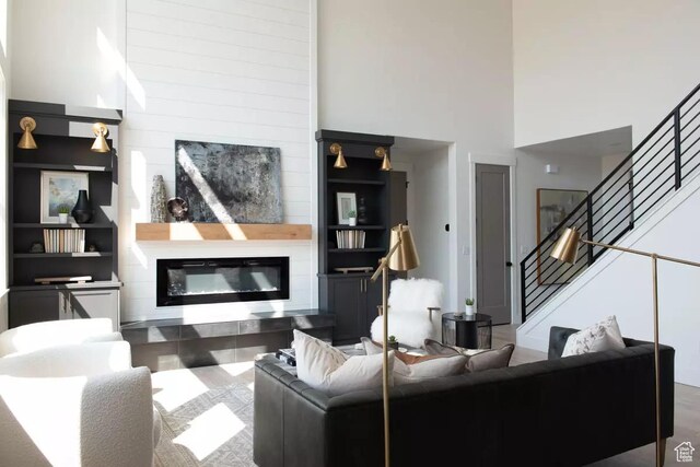 5291 W 3775 S Unit 22, Hooper, UT 84315 - living room featuring a towering ceiling and a fireplace