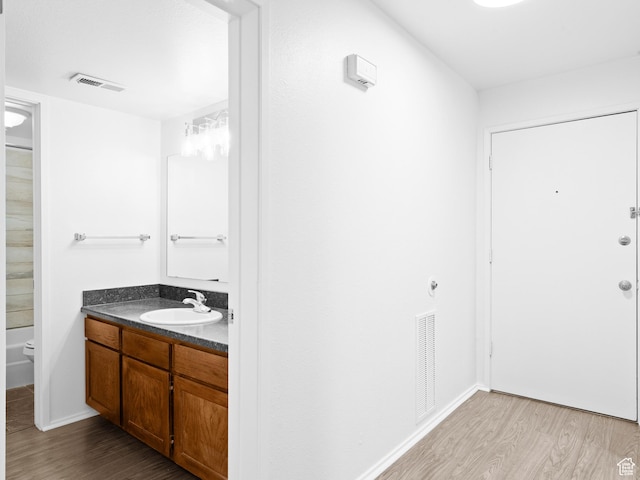 425 S 1000 E Unit 203C, Salt Lake City, UT 84102 - bathroom with hardwood / wood-style flooring, vanity, and toilet