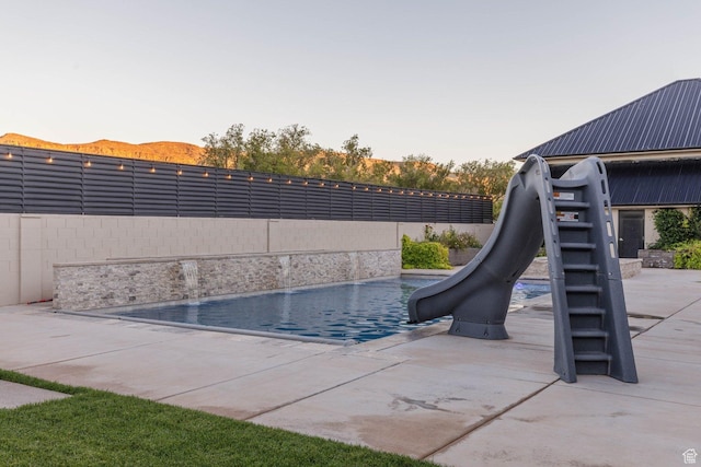 717 S 775 W, Hurricane, UT 84737 - view of pool featuring pool water feature, a water slide, and a patio area