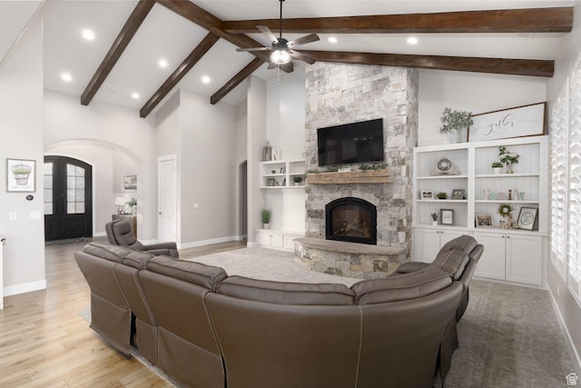 717 S 775 W, Hurricane, UT 84737 - living room featuring beam ceiling, high vaulted ceiling, a fireplace, and light hardwood / wood-style flooring