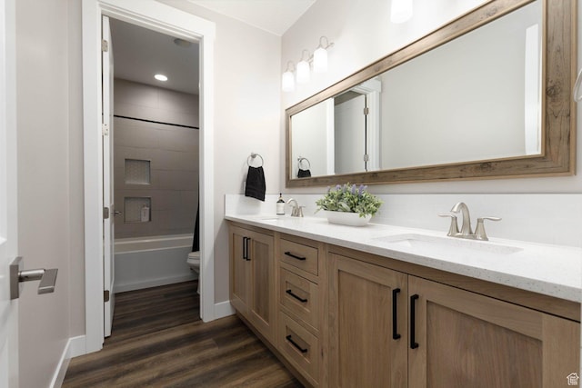 717 S 775 W, Hurricane, UT 84737 - full bathroom featuring vanity, tiled shower / bath, hardwood / wood-style floors, and toilet