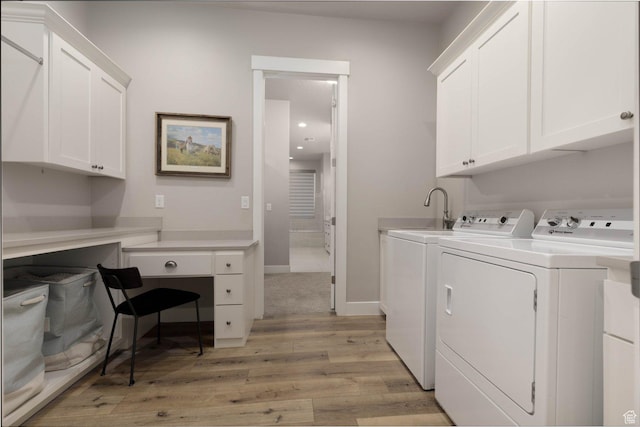 717 S 775 W, Hurricane, UT 84737 - laundry area with cabinets, washing machine and clothes dryer, and light hardwood / wood-style flooring