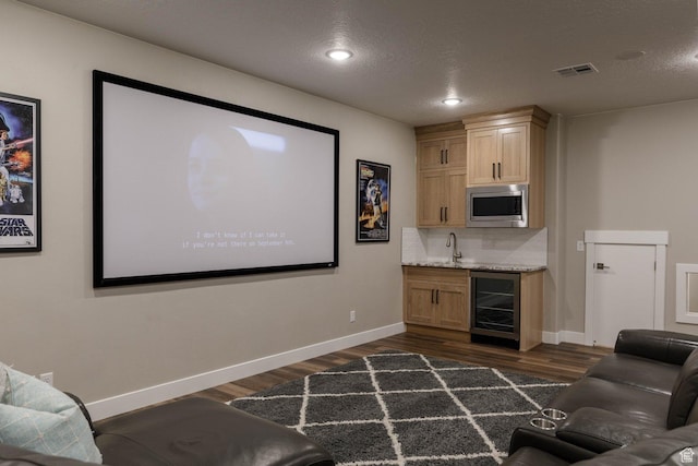 717 S 775 W, Hurricane, UT 84737 - cinema featuring dark wood-type flooring, beverage cooler, indoor wet bar, and a textured ceiling