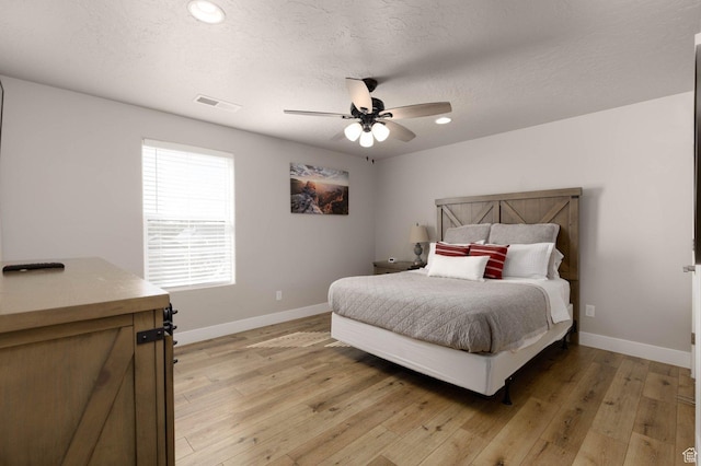 717 S 775 W, Hurricane, UT 84737 - bedroom with ceiling fan, a textured ceiling, and light wood-type flooring
