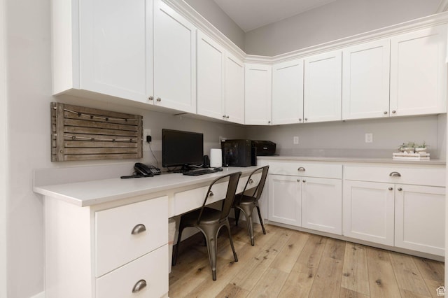 717 S 775 W, Hurricane, UT 84737 - home office featuring built in desk and light hardwood / wood-style floors