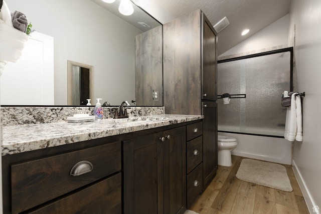 717 S 775 W, Hurricane, UT 84737 - full bathroom with hardwood / wood-style floors, lofted ceiling, shower / bath combination with glass door, vanity, and toilet