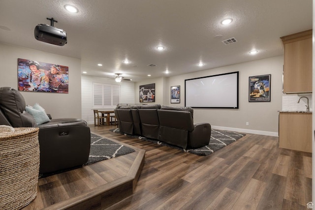 717 S 775 W, Hurricane, UT 84737 - home theater featuring ceiling fan, a textured ceiling, and dark hardwood / wood-style flooring