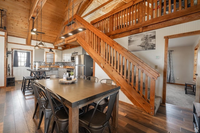 9742 S Crk 29, Duchesne, UT 84021 - dining space with stairs, vaulted ceiling with beams, wooden ceiling, dark wood finished floors, and baseboards