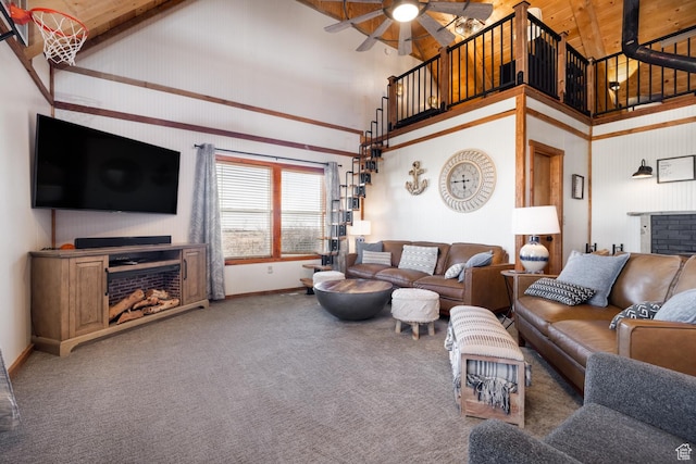 9742 S Crk 29, Duchesne, UT 84021 - carpeted living room with high vaulted ceiling, ceiling fan, baseboards, and a fireplace
